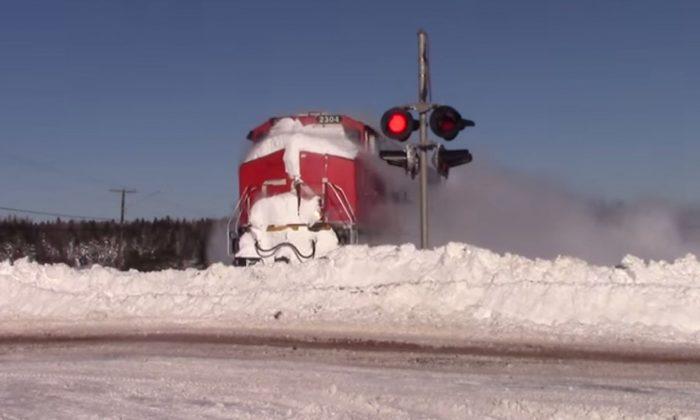 Check Out This Train Demolishing a Snowbank Like it’s Nothing