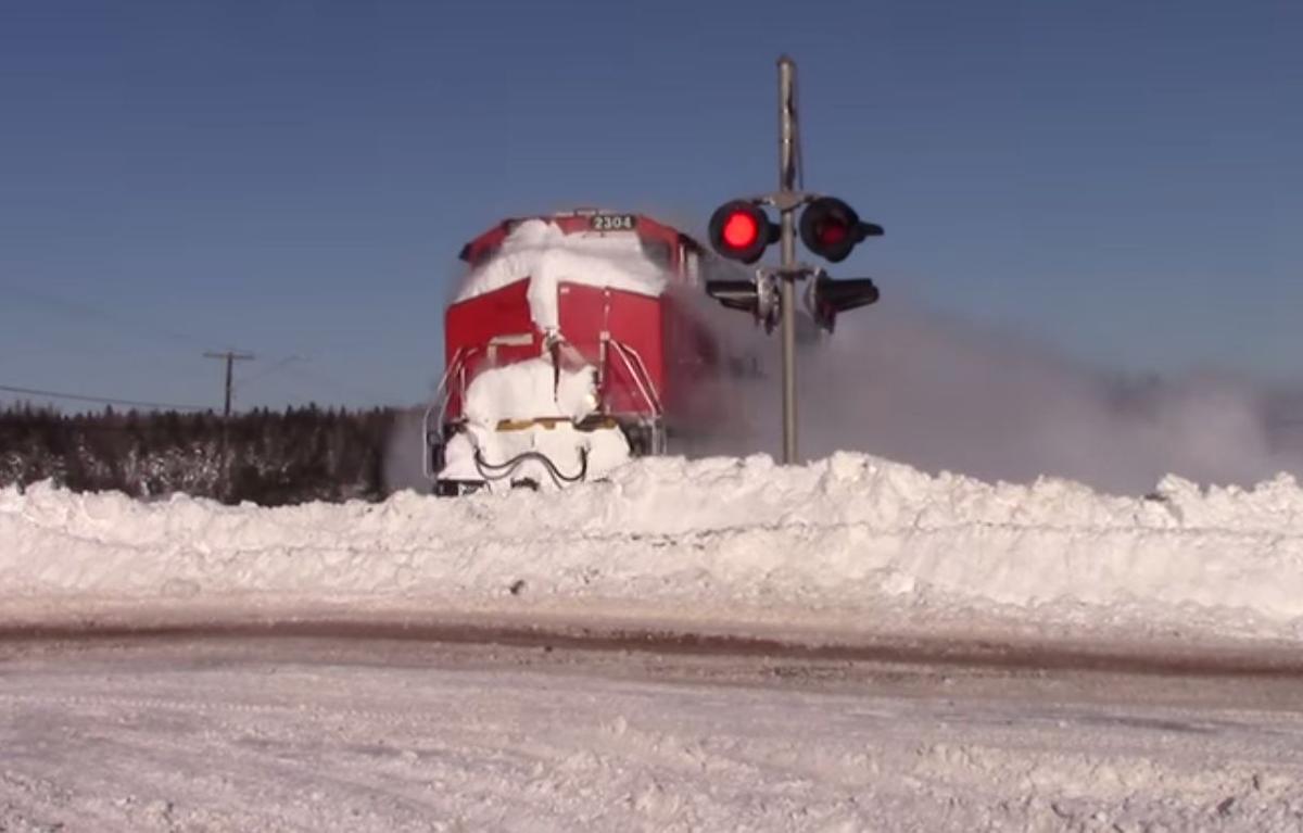 Check Out This Train Demolishing a Snowbank Like it’s Nothing