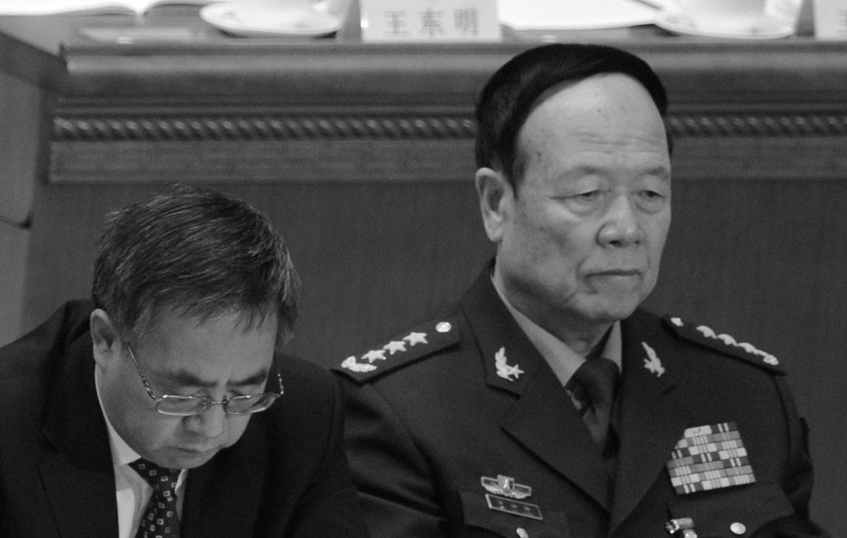 The Communist Party secretary of Guangdong Province, Hu Chunhua (L), and Vice Chairman of the Central Military Commission Guo Boxiong in Beijing. (Goh Chai Hin/AFP/Getty Images)