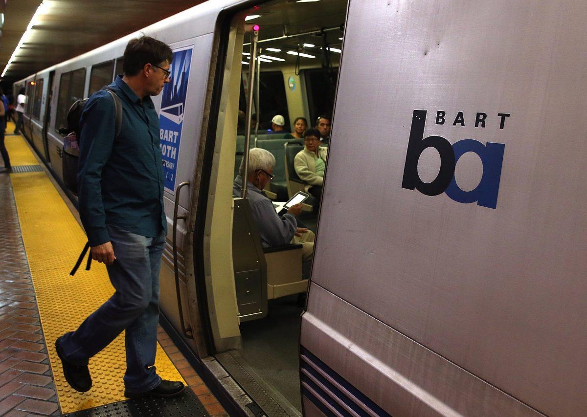 A Bay Area Rapid Transit (BART) passenger boards a train in San Francisco, Calif., on Oct. 15, 2013. (Justin Sullivan/Getty Images)