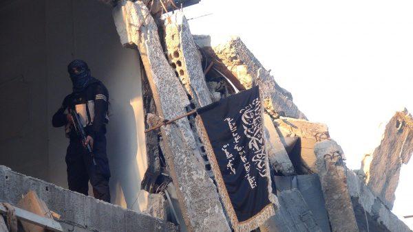 An ISIS terrorist takes up a position in a destroyed in Damascus, Syria, on Sept. 22, 2014. (Rami Al-Sayed/AFP/Getty Images)