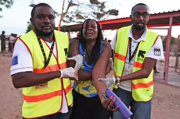 Paramedics help a student who was injured during an attack by Somalia's Al-Qaeda-linked al-Shabaab terrorists on the Garissa University campus, Kenya, on April 2, 2015. (Carl De Souza/AFP/Getty Images)