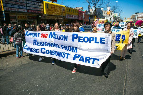 Two thousand people march in a parade in Flushing, New York, on April 25, 2015, calling for an end to the persecution of Falun Gong in China and celebrating 200 million people who have quit the Chinese Communist Party since 2004. (Benjamin Chasteen/Epoch Times)