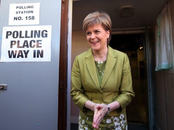 SNP leader Nicola Sturgeon smiles after casting her ballot in the general election at Broomhouse Community Hall in Broomhouse, Scotland, on May 7, 2015. (Scott Heppell/AP Photo)