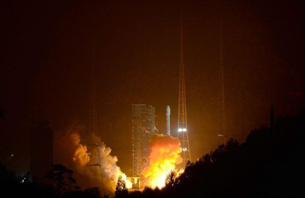 A rocket carrying a lunar probe is launched from Xichang Satellite Launch Center in Xichang, China on Dec. 2, 2013. The Chinese regime is developing space weapons designed to destroy or disable satellites. (ChinaFotoPress/Getty Images)