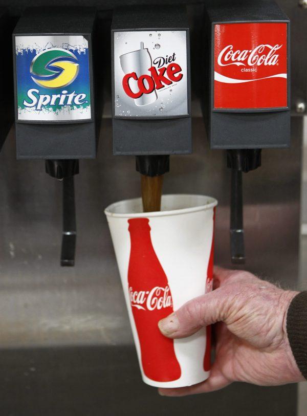 A Costco customer pours a Diet Coke drink at Costco in Mountain View, Calif., on March 3, 2010. (AP Photo/Paul Sakuma)