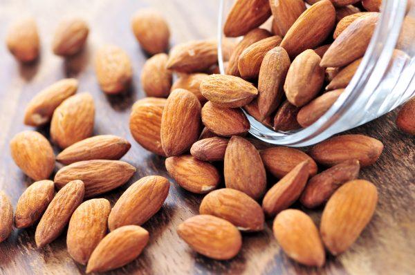Adults who regularly eat a few ounces of almonds have significantly lower total and LDL cholesterol and higher HDL cholesterol (the good kind) (Elenathewise/iStock)