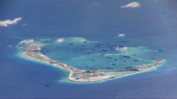 Chinese dredgers work on the construction of artificial islands on and around Mischief Reef in the Spratly Islands of the South China Sea on May 2, 2015. (U.S. Navy)