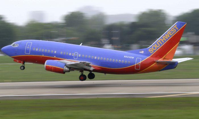 Southwest Flight Attendant Holds Crying Baby in Viral Video