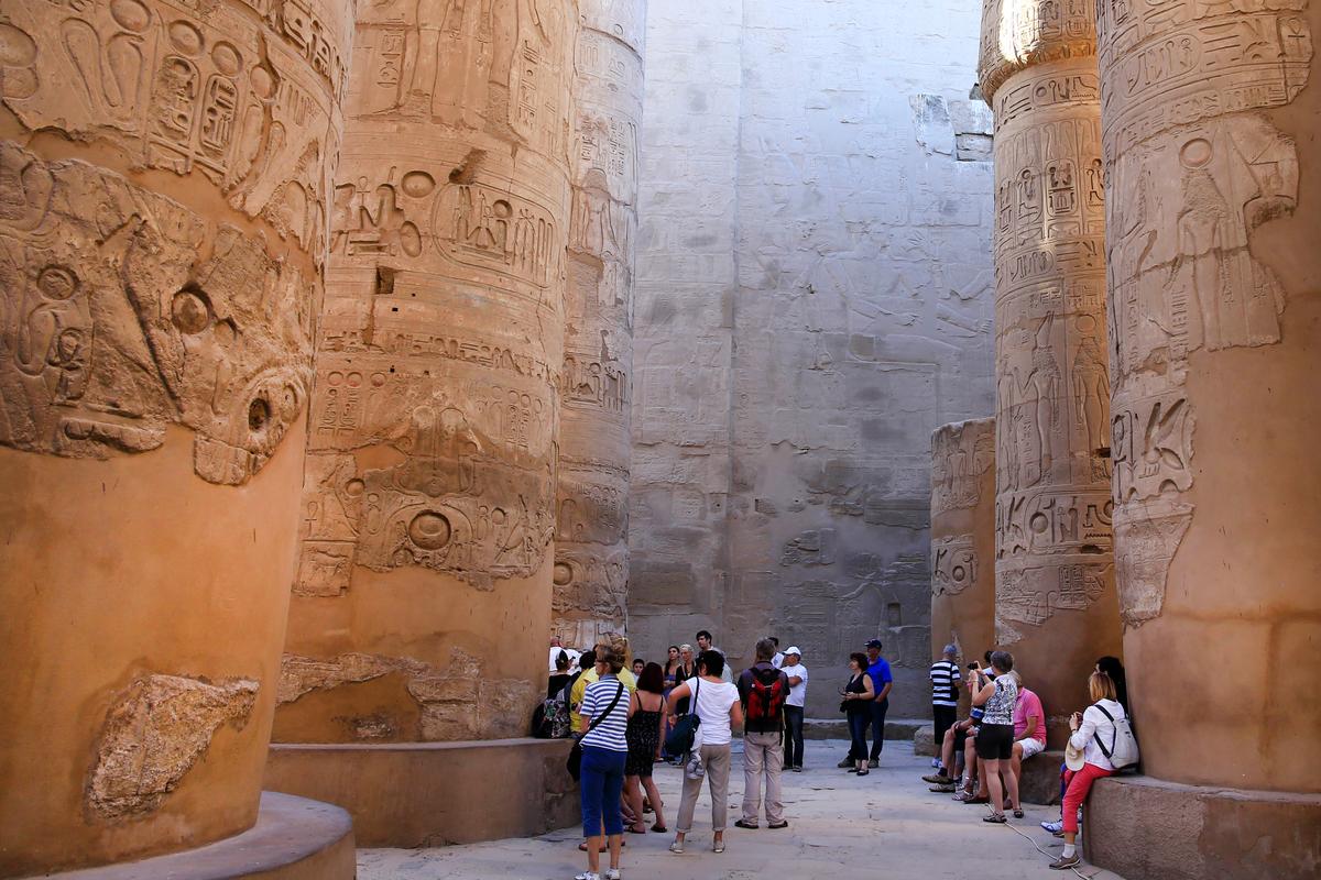 Tourists in the Hypostyle Hall at the Karnak Temple in Luxor, Egypt. (AP Photo/Hassan Ammar, File)