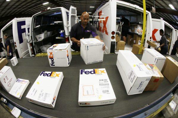 A workers strike in Australia could affect deliveries for Christmas time in Australia. Workers at the FedEx Express station in Nashville, Tenn. (AP Photo/Mark Humphrey)