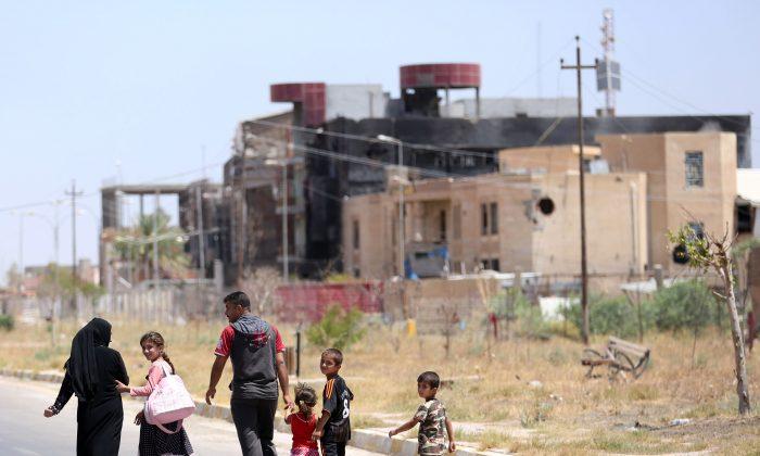 Iraqis Return to Shattered Tikrit After Islamic State Routed