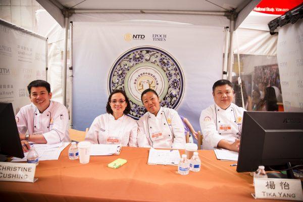 Chef Zhang Hua, far right at the end of the table, sits with the Chef judges panel for the NTD International Culinary Competition during Taste Asia on Times Square in New York City on June 27, 2015. (©The Epoch Times | <a href="http://www.epochtimes.com/b5/15/6/28/n4467963.htm">Edward Dye</a>)