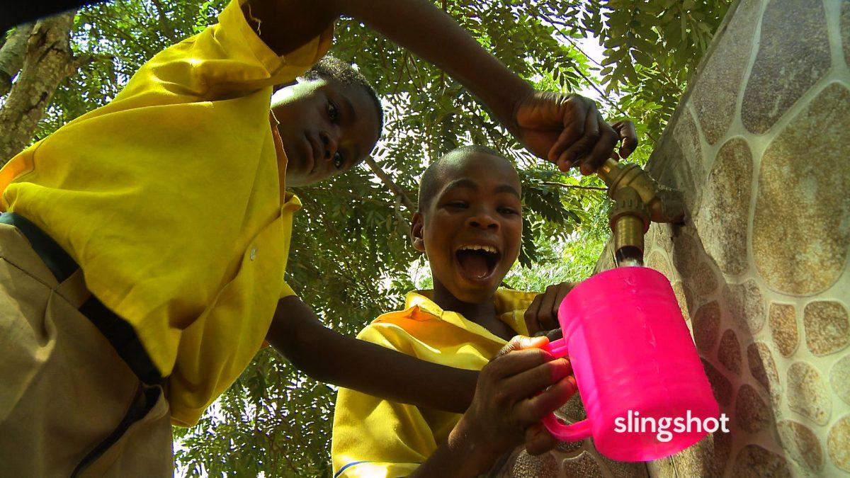 Pakro Methodist School boys getting clean tap water from Slingshot water purifier in "Slingshot." (DEKA Research and Development/White Dwarf Productions)