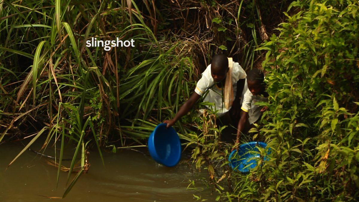 Girls scooping water of questionable quality from the Densu River in Ghana, in "Slingshot." (DEKA Research and Development/White Dwarf Productions)