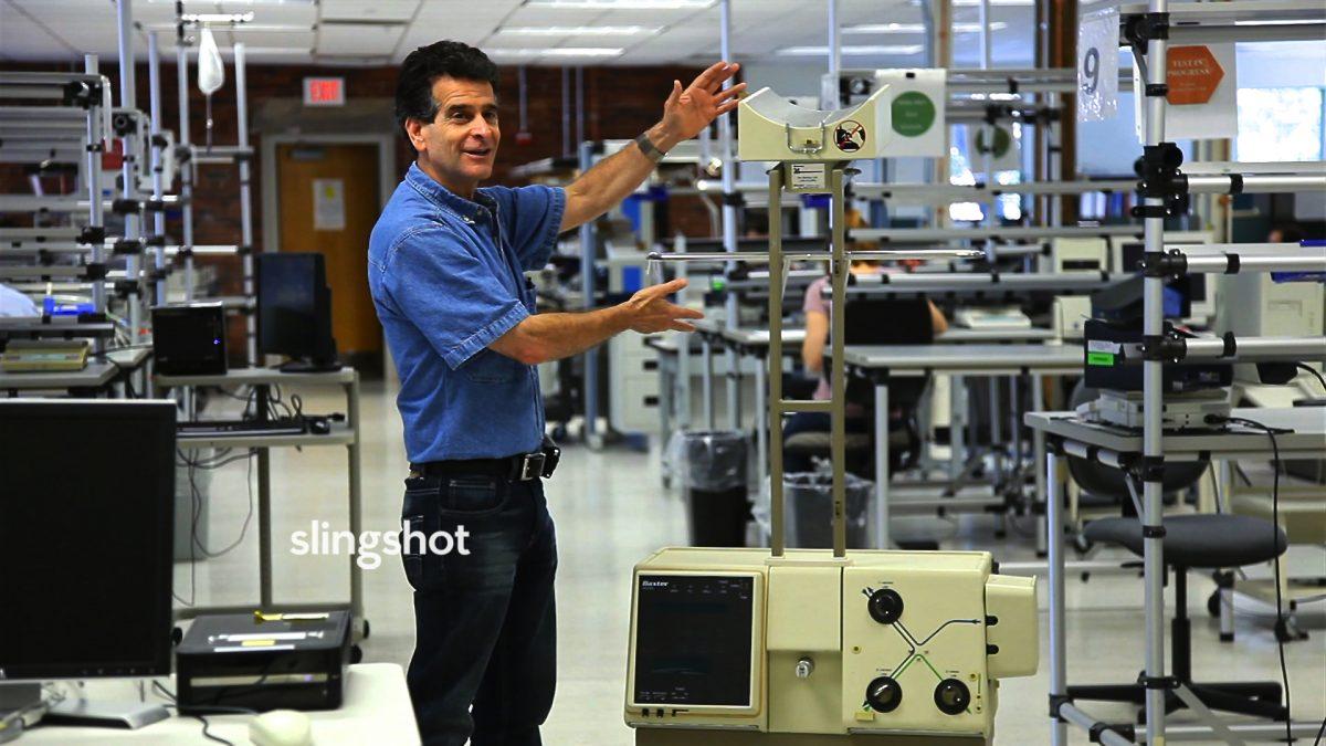 Dean Kamen, with one of the dialysis machines he invented, in "Slingshot." (DEKA Research and Development/White Dwarf Productions)