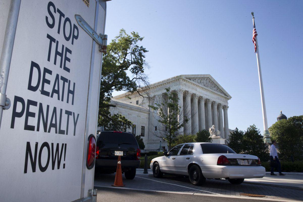 A vehicle parked near the Supreme Court in Washington, has signage that says "Stop The Death Penalty Now," June 29, 2015. (Jacquelyn Martin/AP Photo)