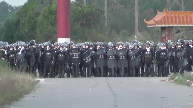 More than 1,000 police in antiriot gear entered Wukan village in Lufeng county, Guangdong Province, before dawn on Dec. 11, 2011. Police fired more than 50 rounds of tear gas and other ammunition. Wukan villagers have staged several large-scale, well-organized protests during the last few months against illegal land grabs and corruption by officials. (Courtesy of Wukan villagers)