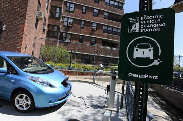 A Nissan Leaf plugged into a charging station at the Seward Park Co-op apartments on Manhattan’s Lower East Side, on May 2011. (Stan Honda/AFP via Getty Images)