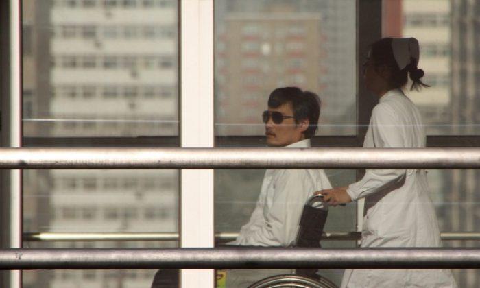 Reports of Threats Mar Blind Chinese Lawyer’s Departure from US Embassy