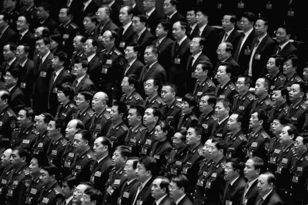 Delegates attend the opening session of the 18th Communist Party Congress on Nov. 8, 2012, in Beijing, China. Many Party officials have found themselves wiretapped recently, and paranoia in the ranks increases amidst an anti-corruption campaign led from the top. (Feng Li/Getty Images)