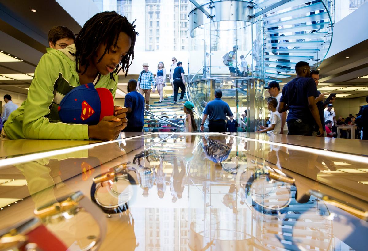 Strong iPhone Sales; Apple Stock Down With Few Watch Details