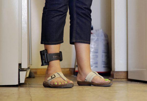 A file photo of someone wearing an ankle monitor. (AP Photo/Eric Gay)