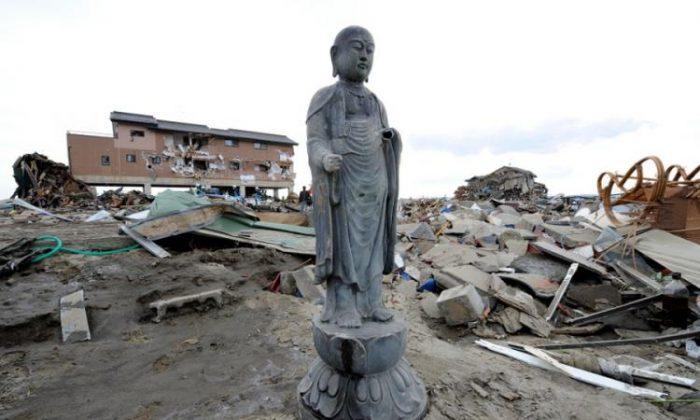 Buddha Statues Stand Amid Rubble After Tsunamis