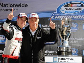 Brad Keselowski celebrates with TEAM OWNER Roger Penske after winning the Nationwide Championship with a third-place finish in the NASCAR Nationwide Series O'Reilly Auto Parts Challenge at Texas Motor Speedway. (Rusty Jarrett/Getty Images for NASCAR)