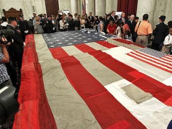 Families, Responders Stitch 9/11 Flag