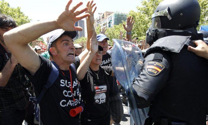 Spain Seeks Tough Austerity Cuts Amid Protests