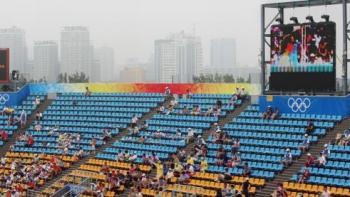 Empty Seats and Flashy Olympics