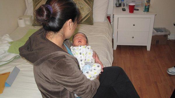 Mrs. Liu fled from China to escape a forced abortion. She gave birth to her baby in Los Angeles on Dec. 2, 2011. (Jenny Liu/The Epoch Times)