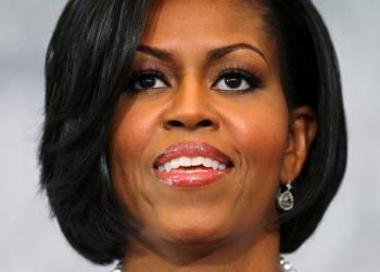 Michelle Obama Cracks Champagne Bottle for Stratton Christening
