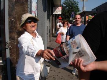 Retired Professor Distributes Newspaper in Flushing