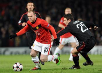 Rooney Nets Twice as Manchester United Crush AC Milan in Champions League