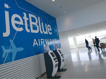 JetBlue Flight Attendant Escapes Argument Through Emergency Exit