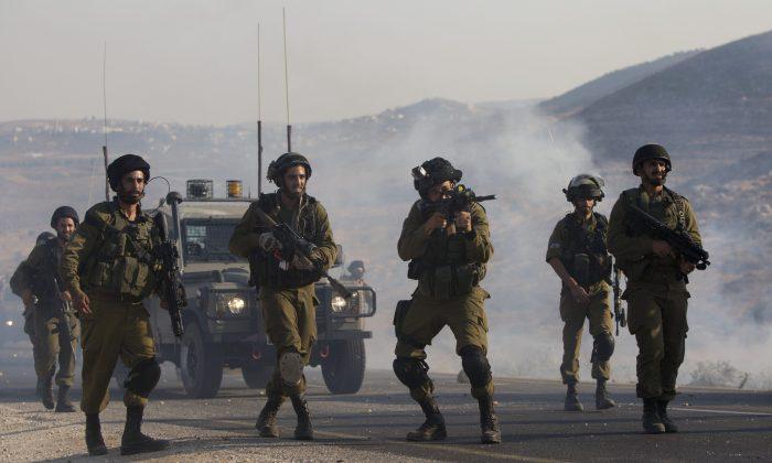 Israel Sends Troops After Settler Couple Killed in West Bank