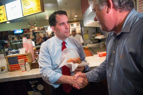 Republican presidential hopeful Wisconsin Gov. Scott Walker greets patrons at the Billy Goat Tavern during a campaign stop in Chicago on July 27, 2015. (Scott Olson/Getty Images)