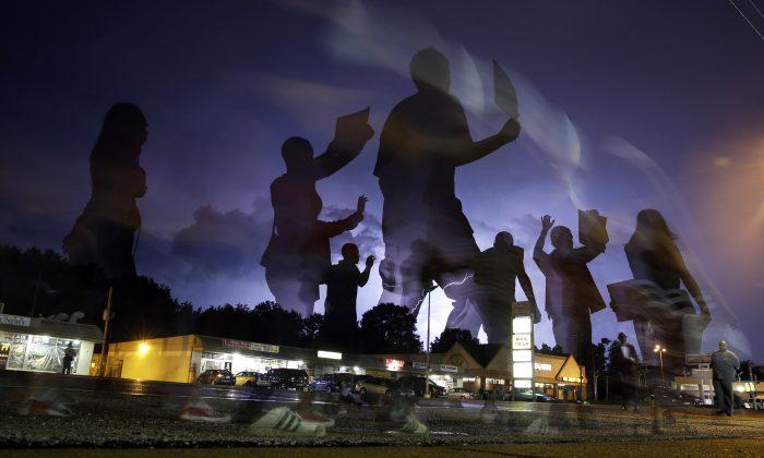March, Moment of Silence Mark Anniversary in Ferguson