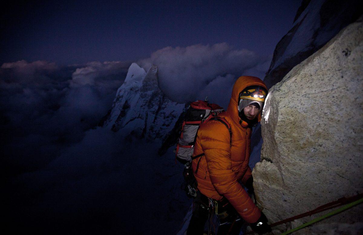 Renan Ozturk taking a quick rest during the long descent from the summit back to the porta-ledge camp after 17 hours on the move, in "Meru." (Jimmy Chin/Music Box Films)
