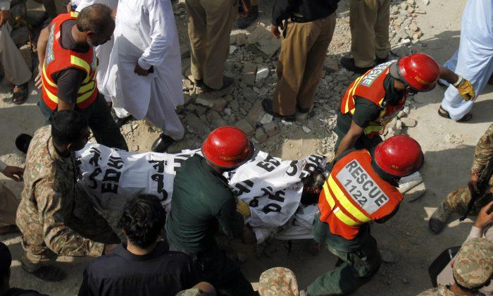 Twin Blasts Kill Anti-Taliban Pakistani Minister, 13 More