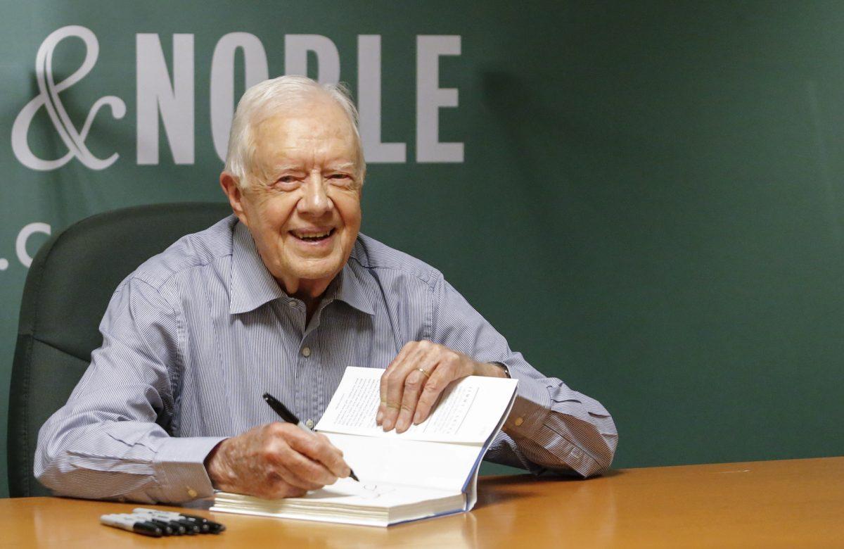 Former US President Jimmy Carter signs his new Book "A Full Life: Reflections at Ninety" at Barnes & Noble on 5th avenue in New York on July 7, 2015. (Kena Betancur/AFP/Getty Images)