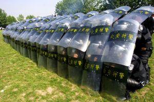 Dozens Injured as Police, Farmers Clash in China