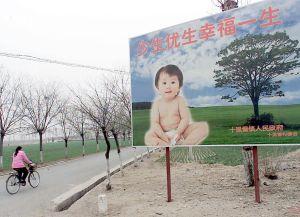 A billboard extolling couples to have only one child, along a road leading to a village in the suburb of Beijing. China has reaffirmed that it would continue enforcing its one-child policy to limit its huge population to 1.6 billion by 2050. (Goh Chai Hin/AFP/Getty Images)