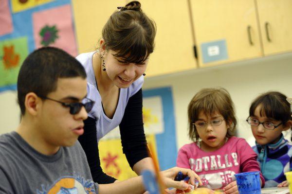 Volunteer art teacher Bojana Coklyat teaches blind students at the School for the Blind in Jersey City, N.J., on April 23, 2012. (Timothy A. Clary/AFP/GettyImages)