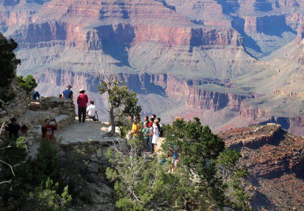 Visitors gather at an outlook on the South Rim of Grand Canyon National Park in northern Arizona, on Aug. 19, 2015. (Felicia Fonseca/AP Photo)