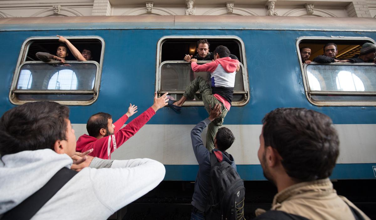 Hungary Opens Door to Trains for Migrants, but Only to Camps
