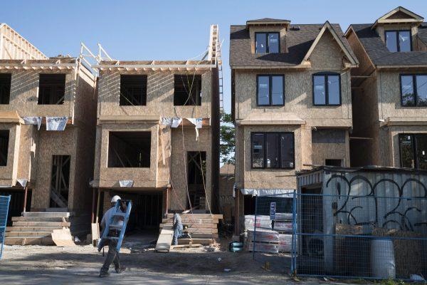 Houses under construction in Toronto in a file photo. Toronto and Vancouver typically have the two least affordable housing markets in Canada. (The Canadian Press/Graeme Roy)