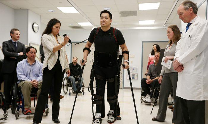 Paralyzed Man Walks With Help From Robot Exoskeleton
